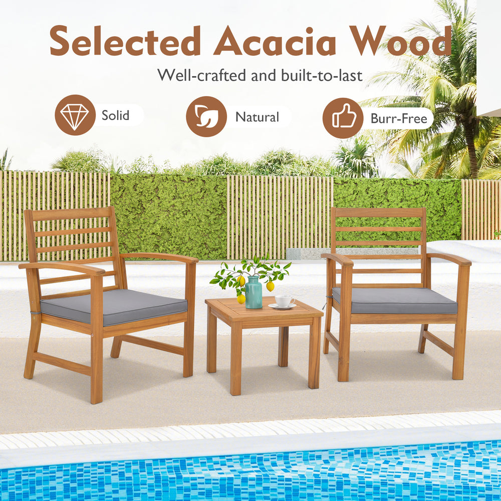 Outdoor furniture set featuring sturdy acacia wood chairs and a table, with gray soft cushions for poolside relaxation.