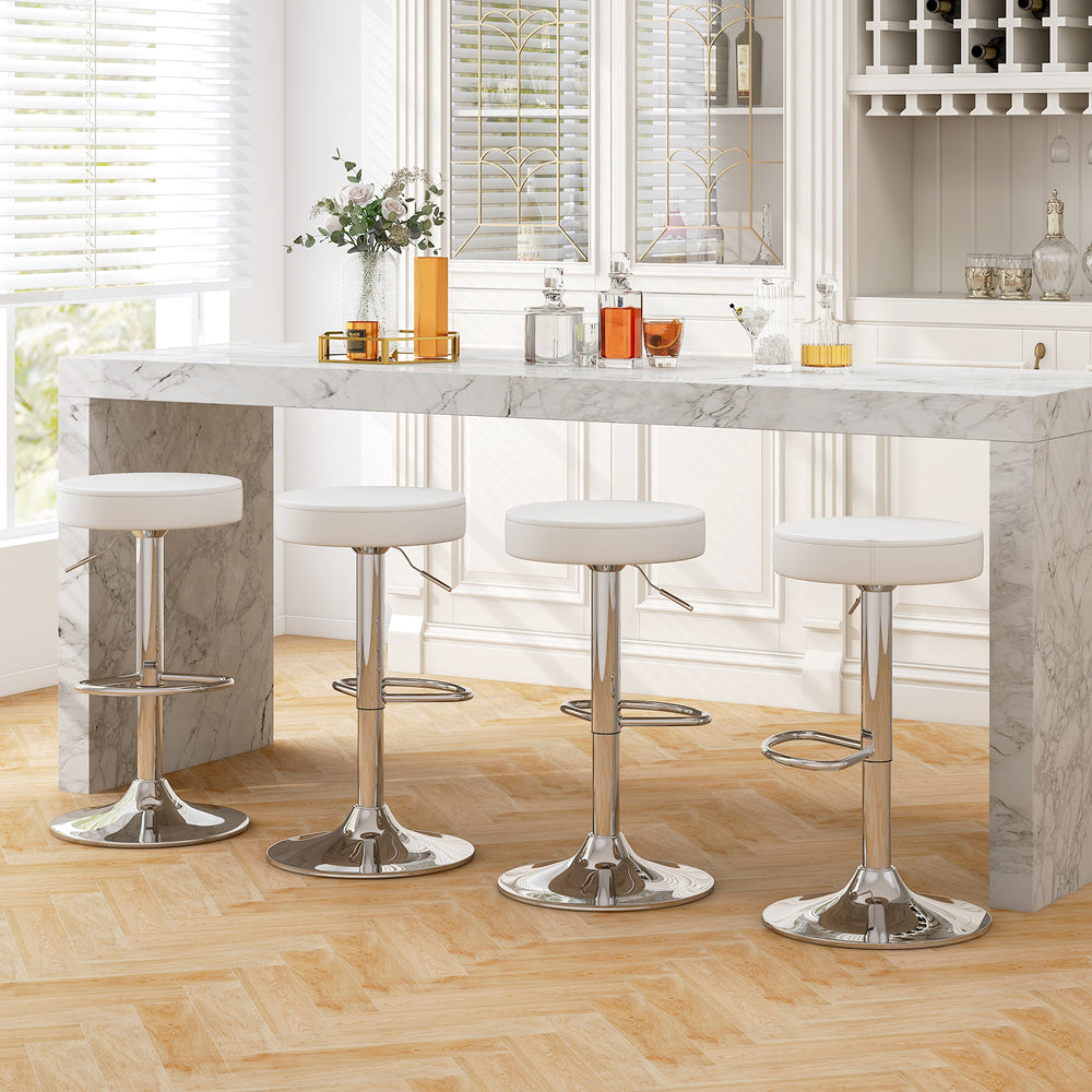 Set of 2 white PU leather swivel barstools with chrome footrest, perfect for bar or extra seating, shown at a kitchen.