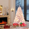 Pre-lit tinsel Christmas tree with warm white LED lights, adorned with gifts, creating a festive atmosphere in a cozy.
