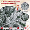 Close-up of snow flocked leaves on a pre-lit 6 ft artificial Christmas tree, featuring soft PE and vibrant PVC textures.