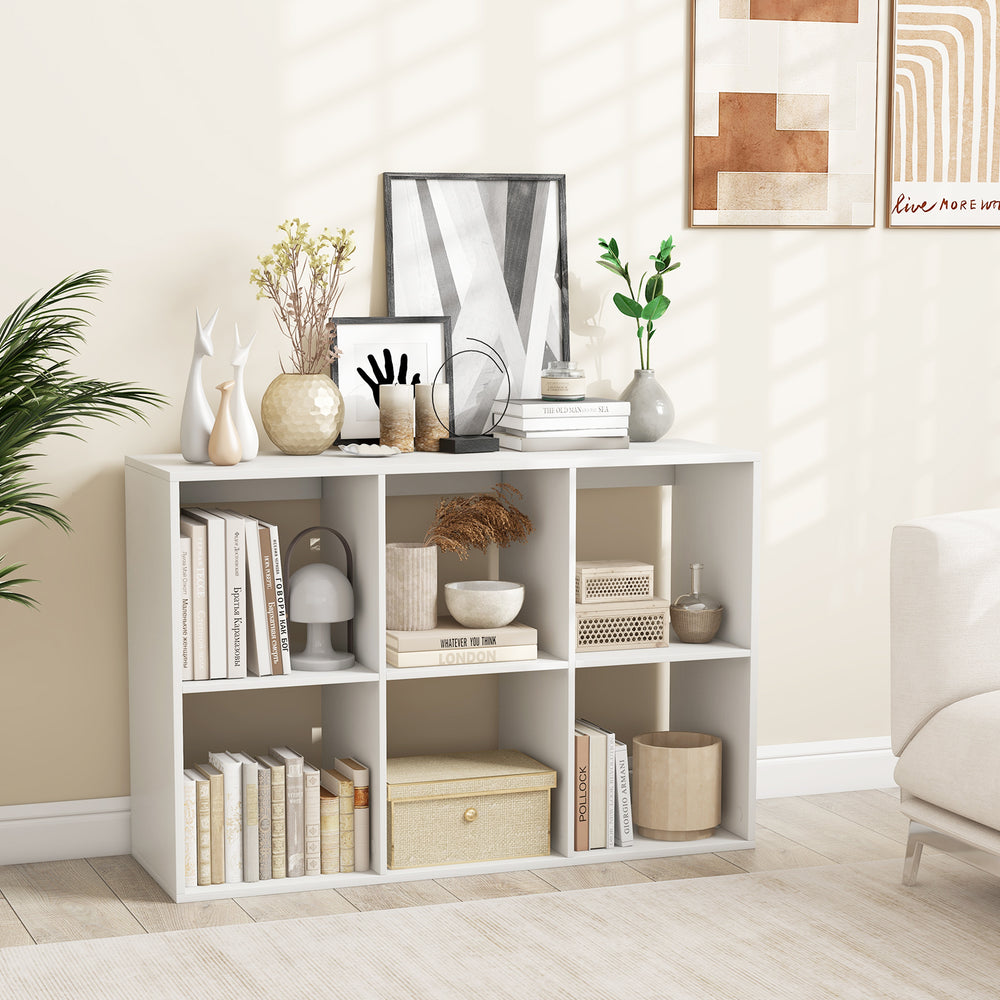 6-cube bookshelf in white with back guardrail, perfect for storing books and decor in living room or bedroom.