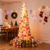 Snow-flocked pink Christmas tree with warm white LED lights, perfect for holiday decoration in homes or cafes.
