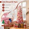 Snow-flocked pink Christmas tree with 392 branch tips and 140 warm white LED lights for festive holiday decoration.
