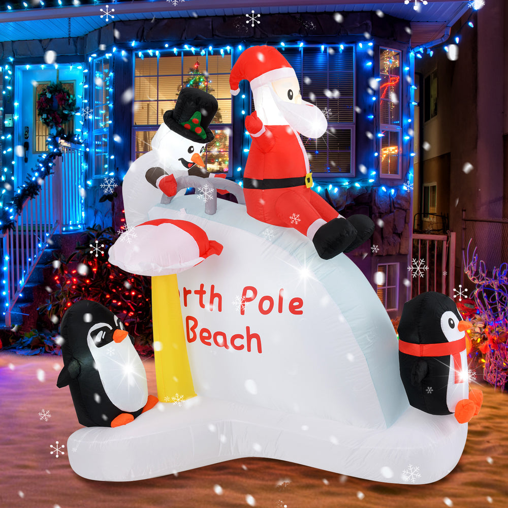 6-foot Christmas inflatable featuring Santa, penguins, and snowman on an ice slide, perfect for festive outdoor decor.