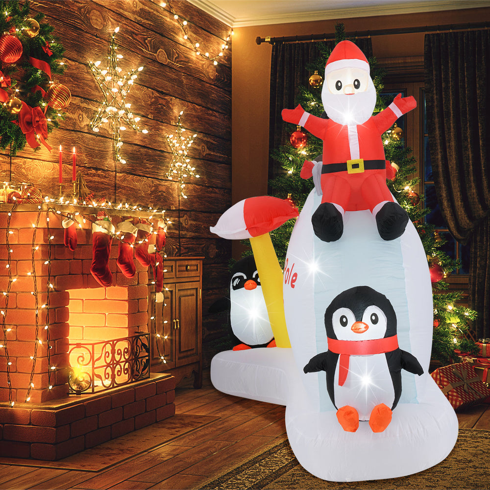 6-foot Christmas inflatable featuring Santa and penguins on an ice slide, with built-in LED lights for festive.