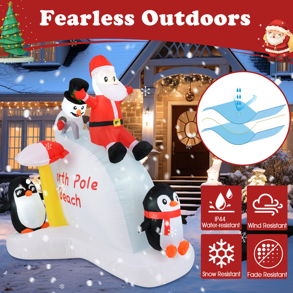 6-foot Christmas inflatable featuring Santa and penguins on an ice slide, water-resistant for outdoor festive decor.