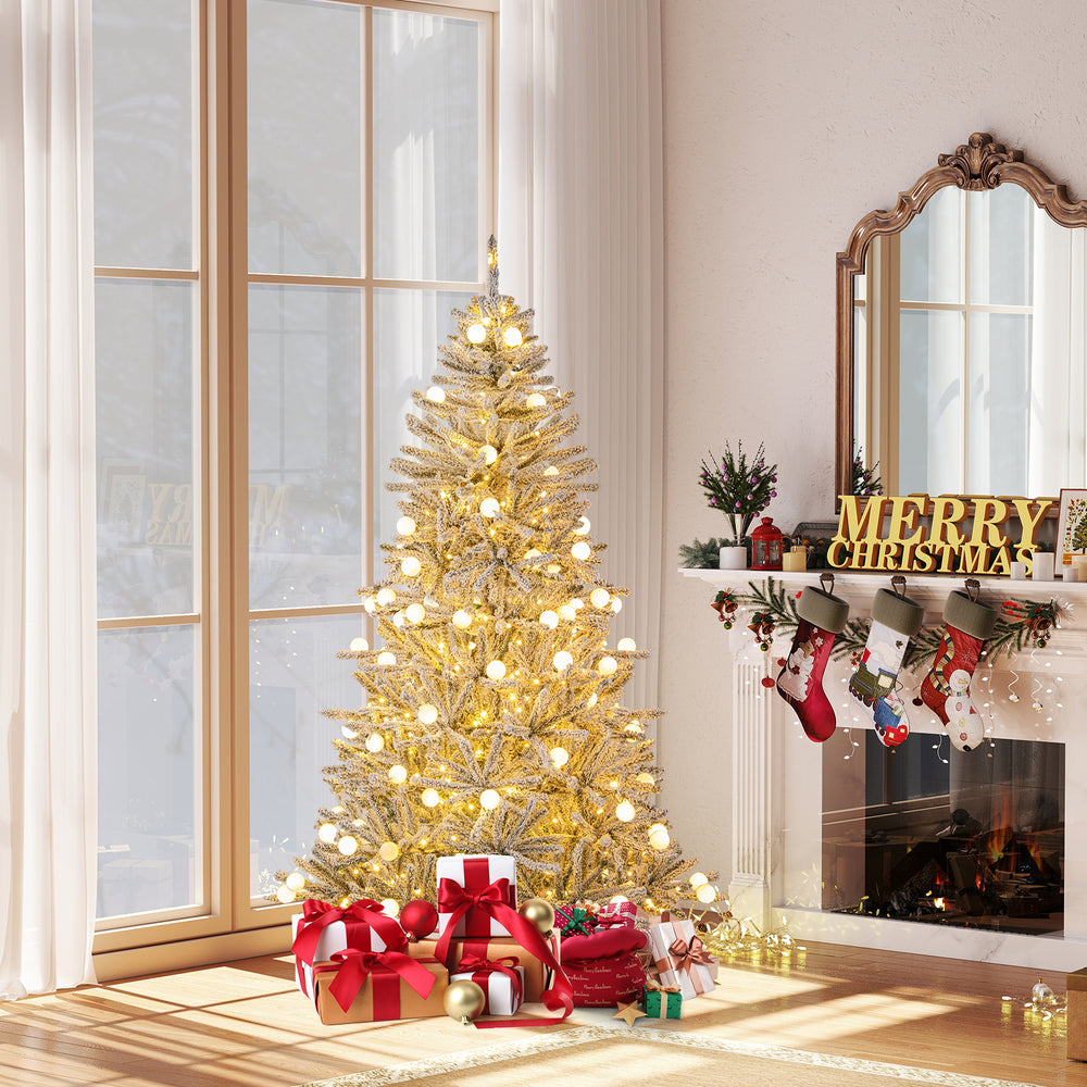 Snow-flocked 6 feet artificial Christmas tree with 81 sphere lights, decorated for a festive holiday setting.