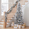 Snow-flocked 6 feet unlit pencil Christmas tree with 500 branch tips, perfect for small corners during holiday celebrations.