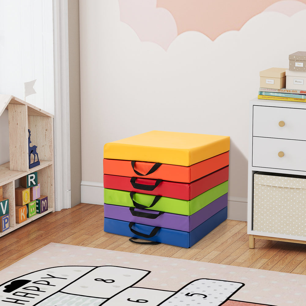 Stack of six multicolor square floor cushions with carry handles, perfect for playtime or relaxation in home or.