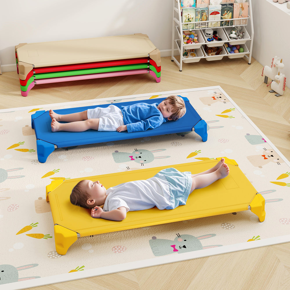 Two kids resting on multicolor portable daycare cots, featuring sturdy design and non-slip foot pads for safety.