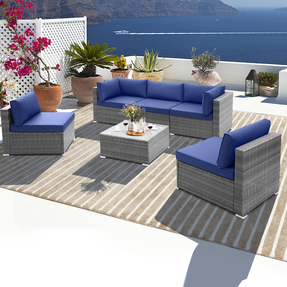 Navy seat and back cushions on a single armchair from the 6-piece patio conversation set with durable PE rattan.