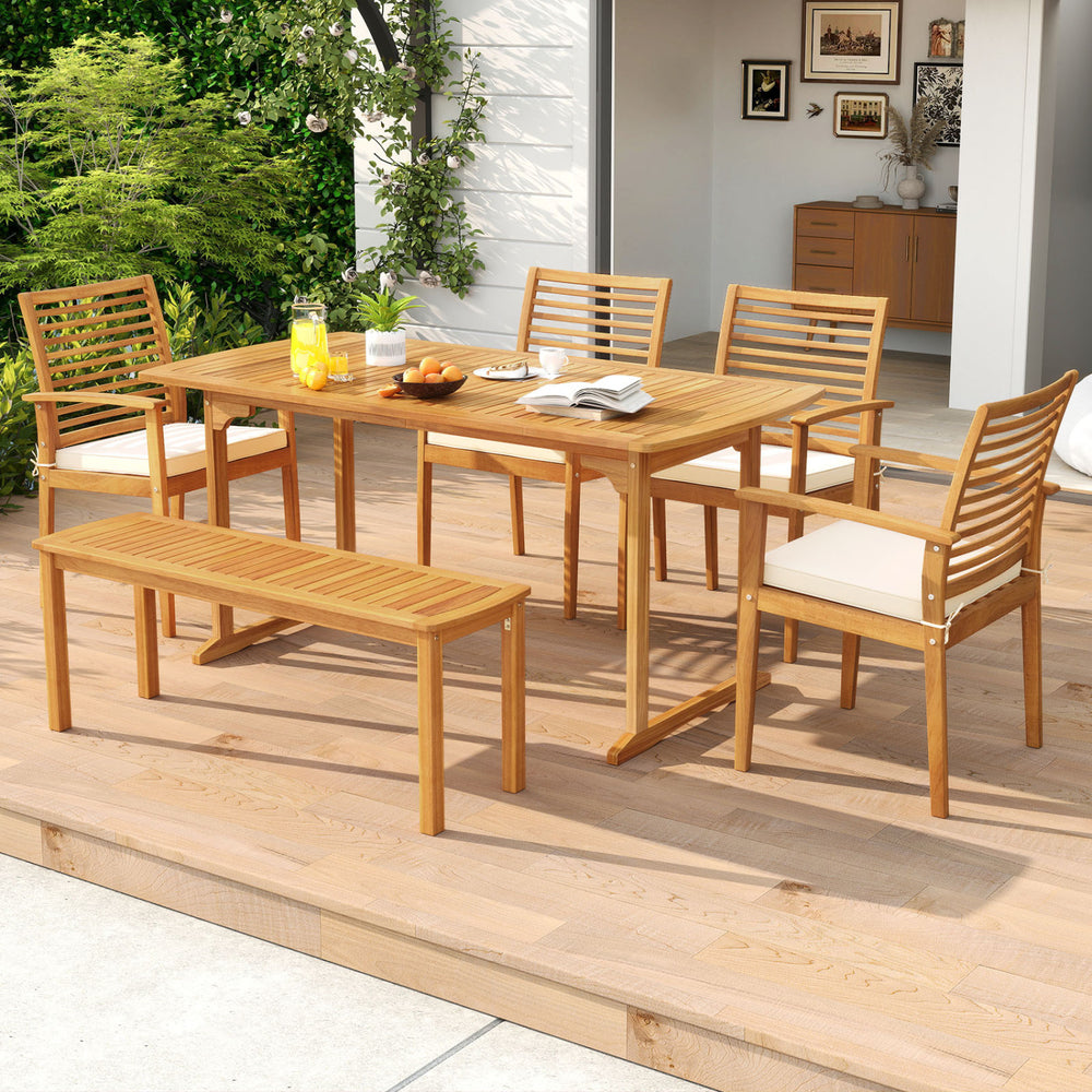 Outdoor acacia wood dining set with six chairs and a bench, featuring an umbrella hole, perfect for backyard gatherings.