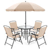 Patio dining set featuring a glass tabletop, four beige folding armchairs, and a shade umbrella for outdoor comfort.