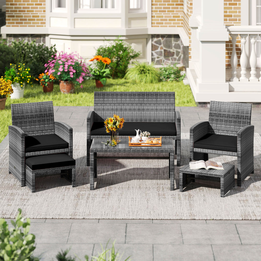 6-piece patio furniture set featuring black PE rattan sofa, chairs, and coffee table for outdoor relaxation.