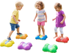 Colorful butterfly-themed stepping stones for kids, promoting motor skills and safe outdoor play in a garden setting.