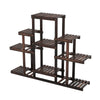 6-tier flower stand made of natural pine wood, featuring a unique symmetric design for indoor or outdoor plant display.