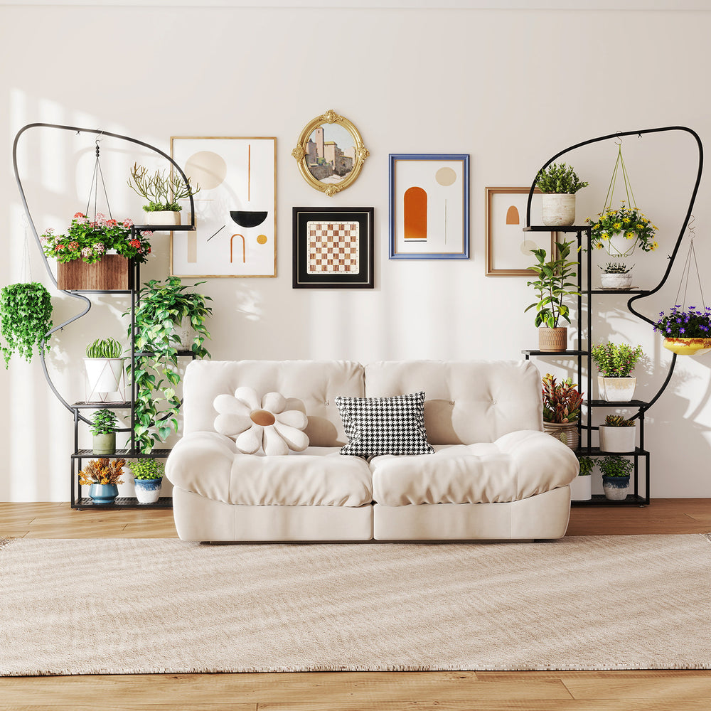 Elegant black 6-tier metal plant stand with butterfly design, showcasing various potted plants in a stylish living.