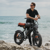 CycRun Pro Electric Mini Dirt Bike - rider at beach - lifestyle shot
