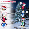 Three stacked penguins in Christmas hats and scarves hold iridescent stars, illuminated by cold white LED lights for holiday cheer.