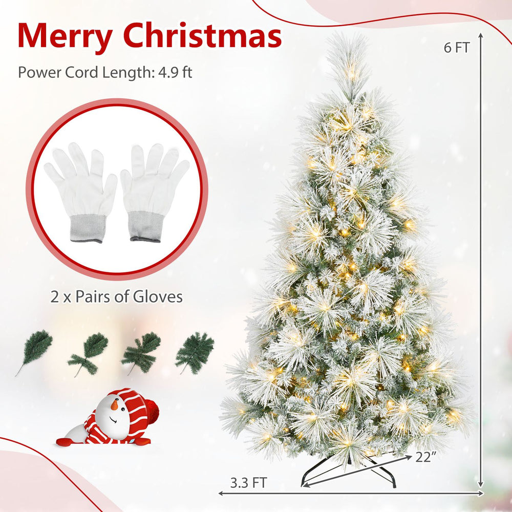 6 ft flocked pine Christmas tree with warm white pre-lit LEDs, folding metal stand, and included gloves.