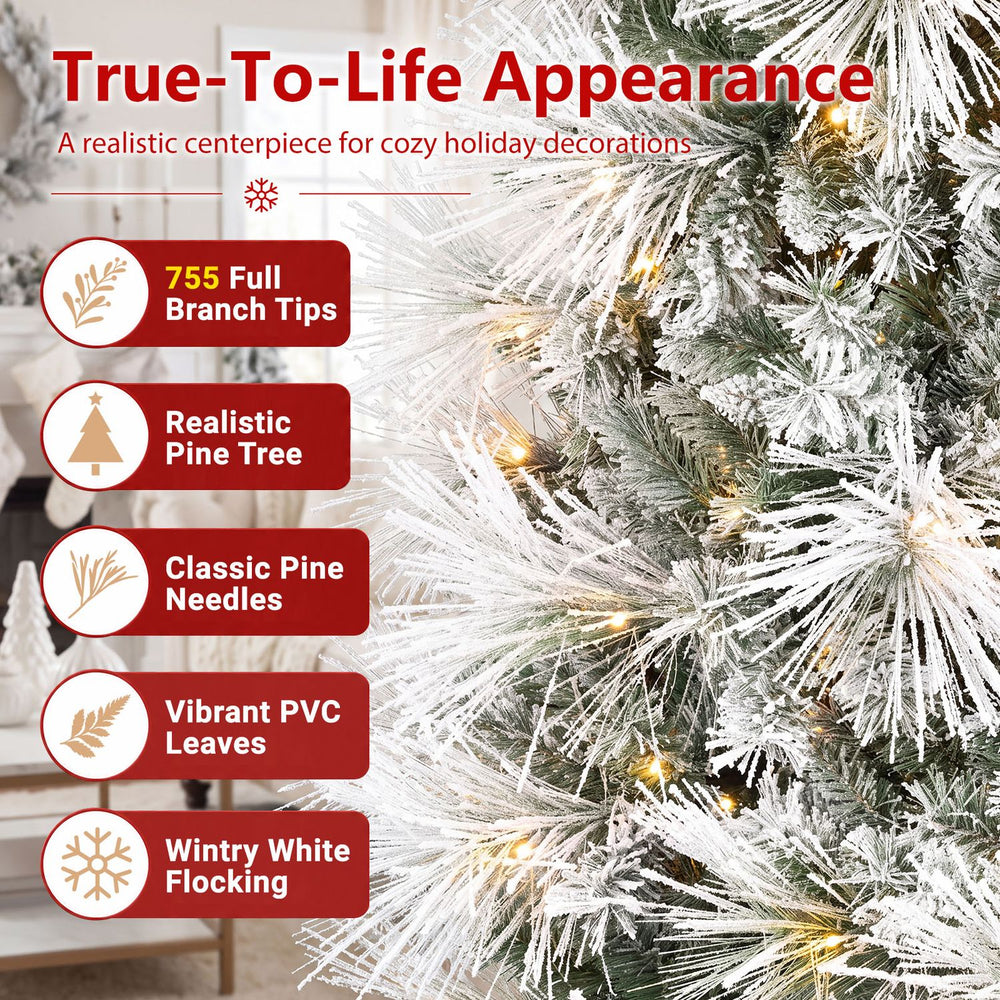 6 ft flocked pine Christmas tree with warm white pre-lit LEDs and folding metal stand, shown as a snowy centerpiece.
