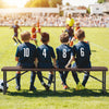 6 ft plastic folding bench with rattan-like texture, supporting 1320 lbs, ideal for outdoor events like soccer games.