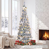 Flocked 6 ft Christmas tree with 20 bows, 35 balls, and 150 warm white LED lights for festive home decoration.