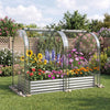Galvanized raised garden bed with greenhouse cover, featuring vibrant flowers and a protective design for year-round.