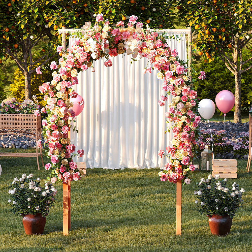 Wooden garden arch arbor adorned with pink roses, perfect for weddings or climbing plants in outdoor settings.