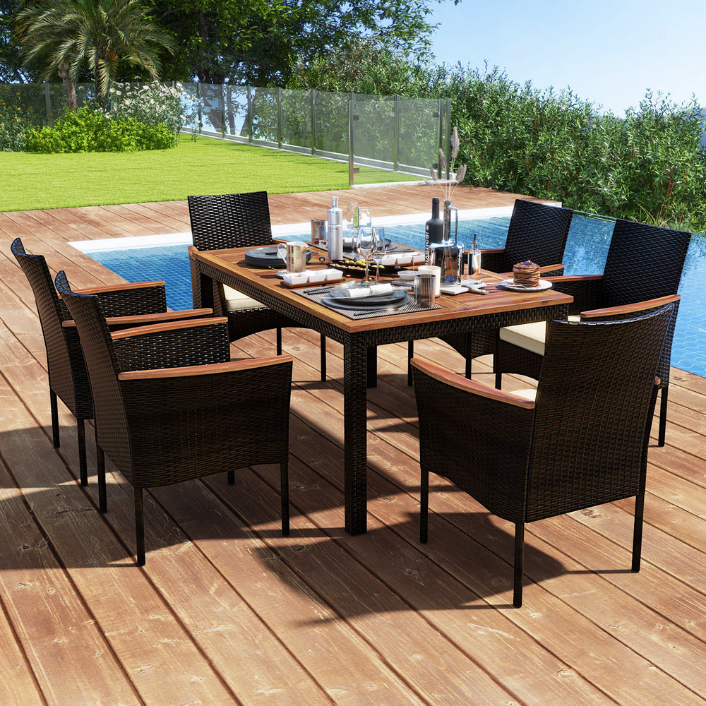 7-piece rattan patio dining set featuring a rectangular acacia wood table and 6 stackable chairs, ideal for outdoor use.