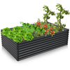 Galvanized metal raised garden bed in dark gray, featuring wave-shaped design and bottomless construction for plant.