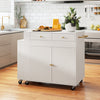Kitchen island with extendable dining table, storage drawers, and spice racks, featuring fluted doors and wheels for mobility.