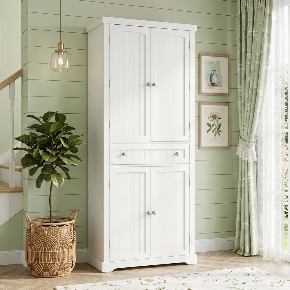 Tall white kitchen cabinet with fluted doors, featuring 4 doors, 6 shelves, and a central drawer for organized storage.