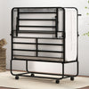 Folding bed with mattress in a compact design, featuring a heavy-duty metal frame and rolling casters for easy mobility.