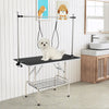Foldable dog grooming table with height adjustable arms, non-slip waterproof surface, and storage mesh tray for pet.