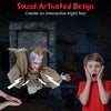 Hanging animated zombie prisoner decoration with sound-activated design, glowing red eyes, and terrifying features for.
