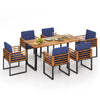 7-piece patio dining set featuring acacia wood table and navy cushions, ideal for backyard and poolside gatherings.