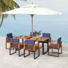 7-piece patio dining set featuring acacia wood table and navy cushions, perfect for backyard and poolside relaxation.