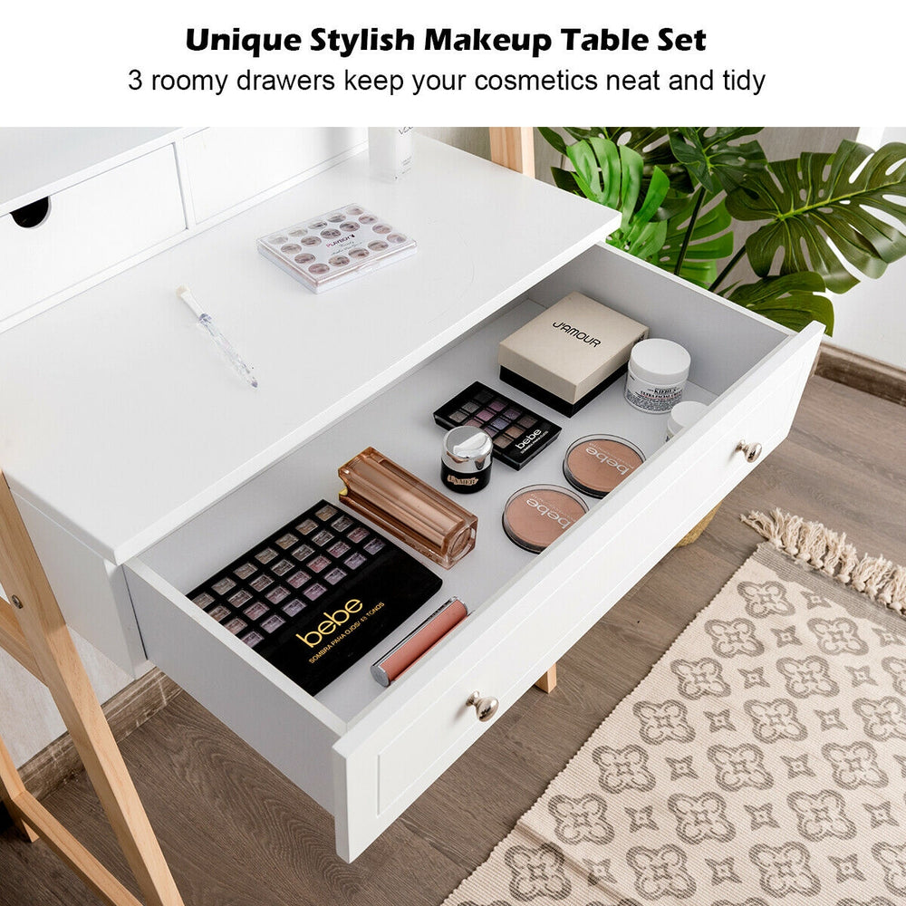 Vanity table set featuring a large drawer and organized cosmetics, with a cushioned stool for comfortable makeup.