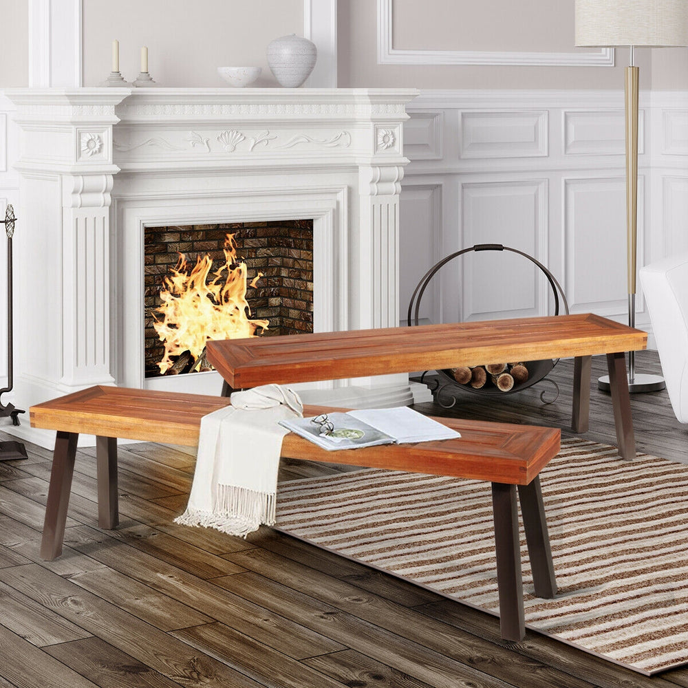 Acacia wood dining benches with steel legs, showcasing a natural finish, perfect for outdoor or indoor use.