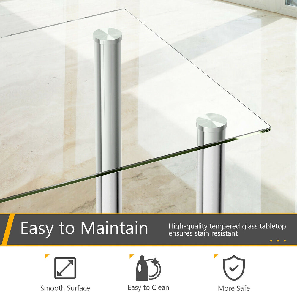 Dining table with clear tempered glass top and sturdy steel legs, part of a 5-piece set with 4 PVC leather chairs.