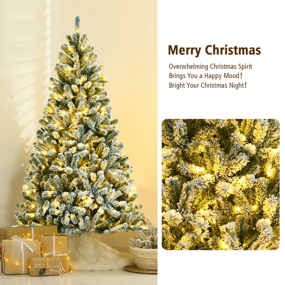 Snow-flocked 6-foot Christmas tree with 928 tips, showcasing the warm white lights for a cozy holiday ambiance.