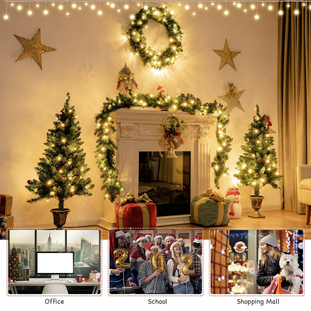 Christmas decoration set showcasing two entrance trees with thick branches and warm white LED lights for festive charm.