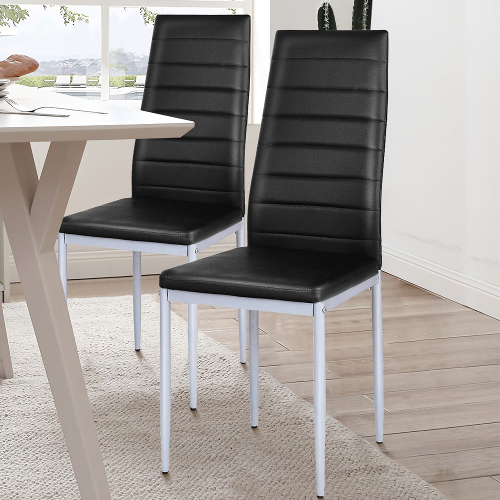 Set of two black PVC leather dining side chairs with painted steel legs, perfect for modern dining spaces.