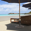 Round umbrella base stand made of premium cast iron in classic bronze, providing stability for patio umbrellas.
