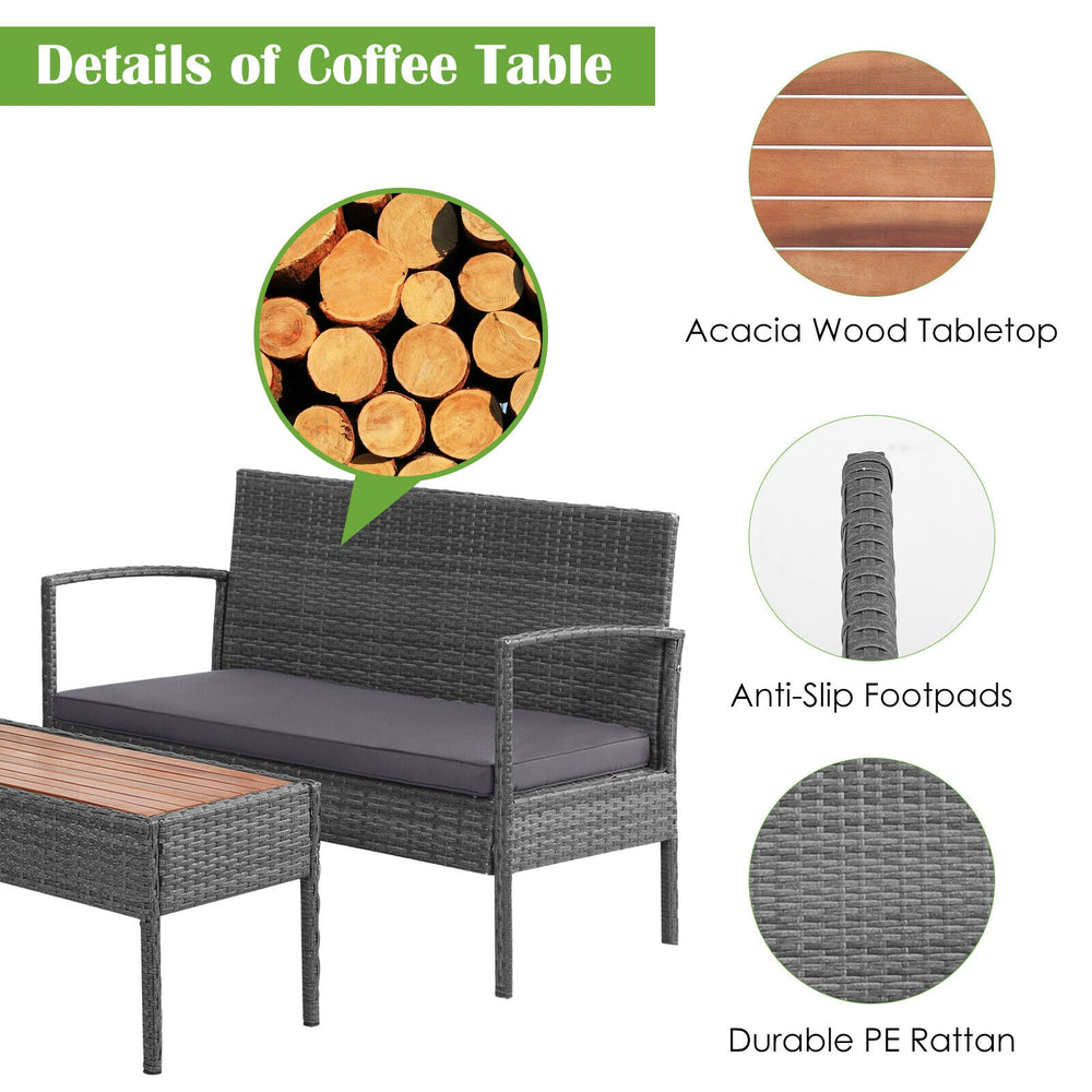 Detail of the coffee table featuring a durable PE rattan base and wide acacia wood tabletop for outdoor use.