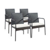 Four-piece patio wicker rattan dining set with comfy cushions, featuring a sturdy steel frame and ergonomic armrests.