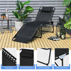 Foldable black lounge chair with adjustable backrest and footrest, made of breathable fabric and sturdy steel for.