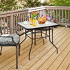 Black steel square table with tempered glass top, perfect for outdoor dining and compatible with umbrellas.