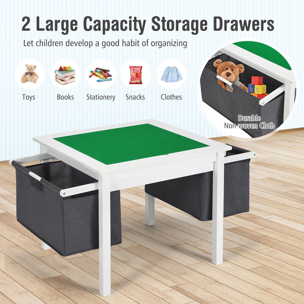 Kids double-sided activity table with green building block surface and two large storage drawers for toys and books.